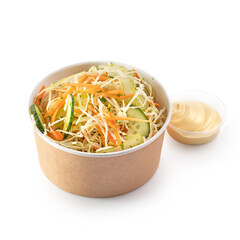 Fresh cabbage and carrot salad in a paper bowl for take away or food delivery isolated on a white...