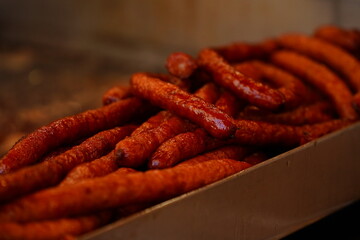 Meat and sausages on the grill. Prepared from meat with a delicious taste. Appetizing sausages. Detail photo.