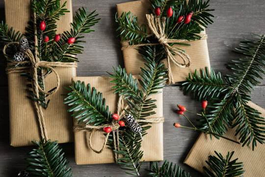 Naturally wrapped Christmas presents decorated with spruce twigs