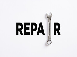 The word repair written with a wrench. To repair or fix something broken, maintenance service...