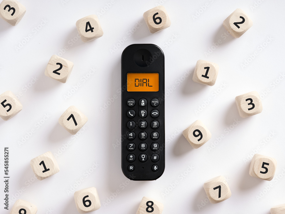 Poster retro wireless phone or telephone with the word dial on the screen with numbers around it. dialing a