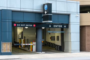 Naklejka premium Entrance and exit to/from a parking lot on the street.