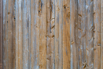 Vertical wooden brown and grey bars background. Texture of the pine boards lie vertically. Wood background