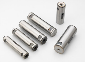 precision-machined metal spring pins for use in automobile applications