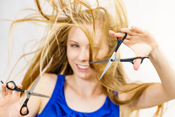 Girl with scissors for haircutting