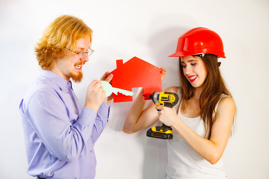 Couple doing house model renovation