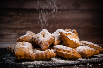 TRADITIONAL WONDERS OF SOUTH-WESTERN FRANCE, SPRINKLED WITH ICING SUGAR AND FLAVOURED WITH RUM AND ORANGE FLOWER WATER, High quality photo