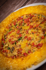 Recipe Omelette with peppers, onions, tomatoes, courgettes and coriander. High quality photo