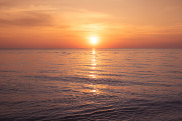 Naklejka na ściany i meble Natural Sunset Sunrise over the ocean. Beach vibe.