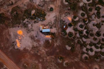 Aerial drone shot abandoned mine shafts in desert landscape