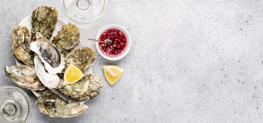 Fototapeta na wymiar Fresh oysters with glasses of sparkling wine