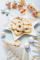Fototapeta na wymiar Homemade Christmas cookies and ornaments on kitchen table