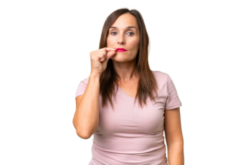 Middle-aged caucasian woman over isolated background showing a sign of silence gesture