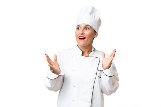 Middle-aged chef woman over isolated background with surprise facial expression