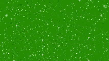 Realistic snow falling on a green screen background. Winter snow effect