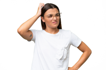 Young caucasian woman isolated on green chroma background having doubts while scratching head