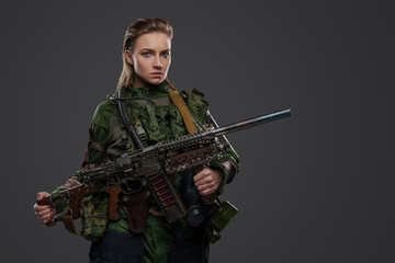 Portrait of female soldier after armageddon with self made shotgun and camouflage uniform
