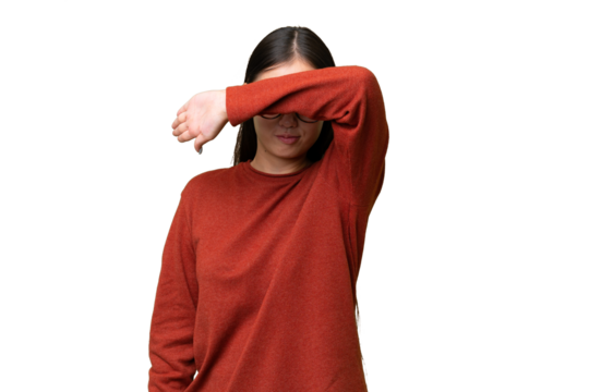 Young Asian woman over isolated background with pain in elbow