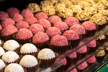 Chocolate varieties. Assortment of truffle chocolates displayed on the counter. Bakery products