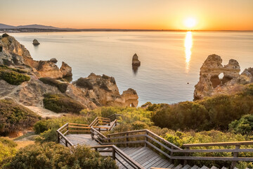 Praia do Camilo beach at sunrise near Lagos town, Algarve province, Portugal.