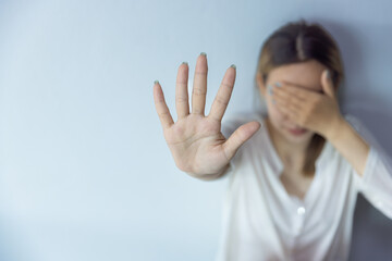 woman raising her hand Concept of stop violence against women, human trafficking, rape, sexual...