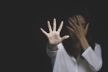 woman raising her hand Concept of stop violence against women, human trafficking, rape, sexual...