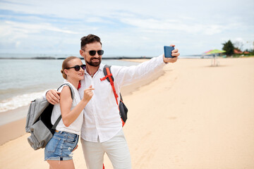 Fototapeta na wymiar Happy Tourists Taking Selfie