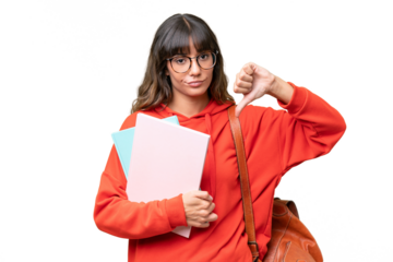 Young student caucasian woman over isolated background showing thumb down with negative expression