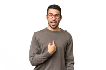 Young handsome caucasian man over isolated background with surprise facial expression