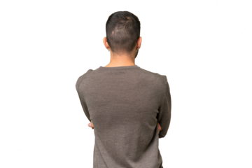 Young handsome caucasian man over isolated background in back position