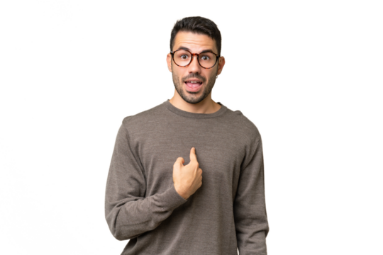 Young handsome caucasian man over isolated background with surprise facial expression