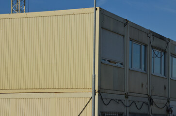 modular housing in stacked container cells. each module has a different function. it includes a...