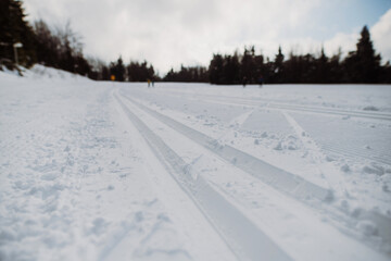 Fototapeta na wymiar Close-up of fresh snow at cross country skiing track.