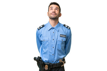 Young police caucasian man over isolated background and looking up