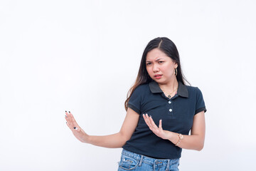 A disgusted woman shunning and keeping her distance from the left area. Using her hands to gesture...