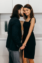 Happy couple cute touch each other in the kitchen