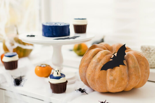 Cupcakes with pumpkin kept on table at home