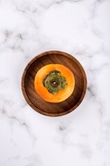 persimmon on a marble background