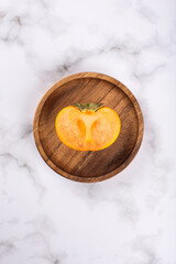 persimmon on a marble background