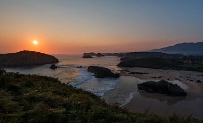 Waves crashing on Borizo beach, in Asturias, Spain, at sunrise