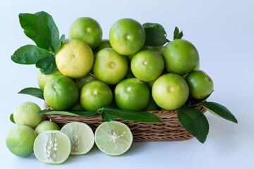 Fresh green lemons, in basket , Fresh green lemons at market and shop for sell..