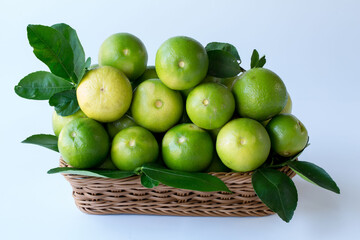 Fresh green lemons, in basket , Fresh green lemons at market and shop for sell..