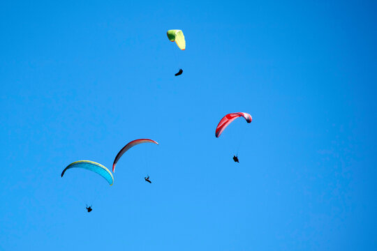 Photo Shoot Of The Flight Of A Paragliding Group