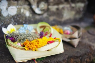 Offerings of flowers and incense sticks at Pura Tirta Empul, the Hindu Holy Water Temple, near Tampaksiring — Bali, Indonesia