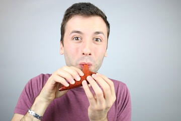 Young Caucasian Man playing wood Ocarina 