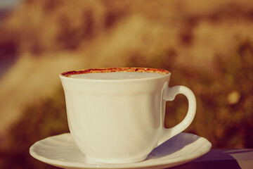 Coffe cup on nature. Outdoor picnic.