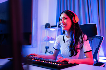 Asian beautiful Esport woman gamer play online video game on computer. 