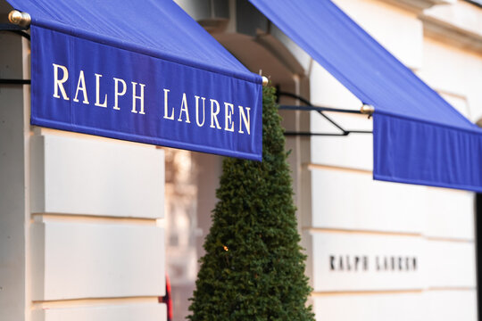The logo sign of Ralph Lauren luxury clothing company on top of a store from Paris, France, 2022.