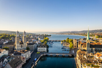 Aerial drone shot flying above Lake Zurich, Switzerland in sunny day.
