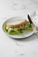 Coronation sandwich made with coronation chicken and salad